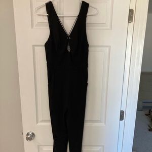 Bebe black jumpsuit, low back, stretchy